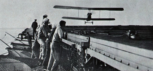 Plane in for a landing on Navy's first carrier, USS Langley, in early 1920s.