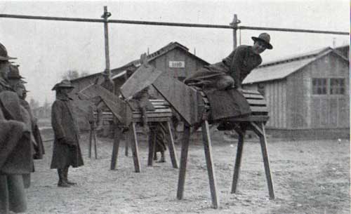 Green recruits practicing mounting on wooden horses