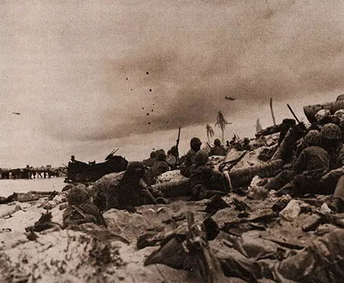 U. S. Marines Storming a Beach in the Pacific, Under Support of Marine Dive-Bombers.