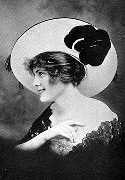 Portrait Hat in Black and Cameo Pink. the Velvet Covering the Wide Brim Is Overlaid With Ostrich Fringe and Trimmed With a Large-Petaled Velvet Flower.