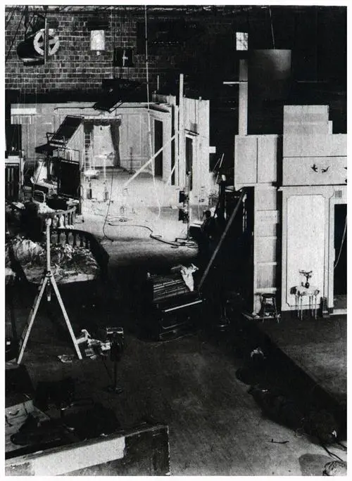A Movie Workshop. On the Floor Are Several Indoor Sets and an Exterior.