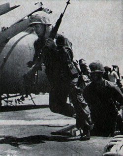 COMBAT troops race across USS Iwo Jima's flight deck