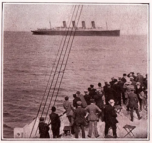 Mauretania in Background as Passengers from the Ship head to Shore at Fishguard, Wales 1909.