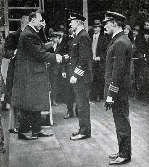 Captain Fried of the S.S. President Roosevelt Congratulated by a Representative of King George.