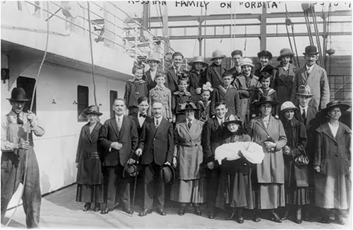 Well-Dressed Family of 27 (Ostrovski) - Russian Refugees Posed on Deck of the SS Orbita.