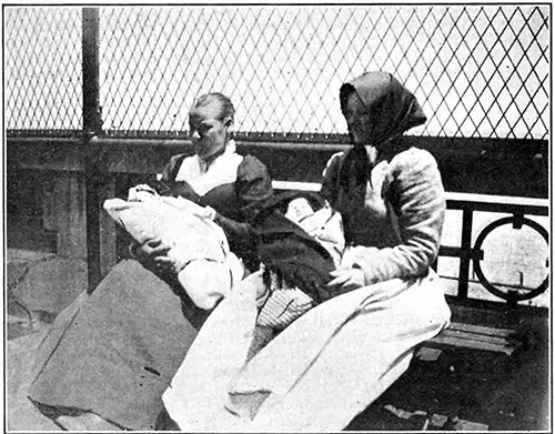 Two Young Dutch Mothers, Their Babies in Swaddling Clothes, On the Roof of Ellis Island.