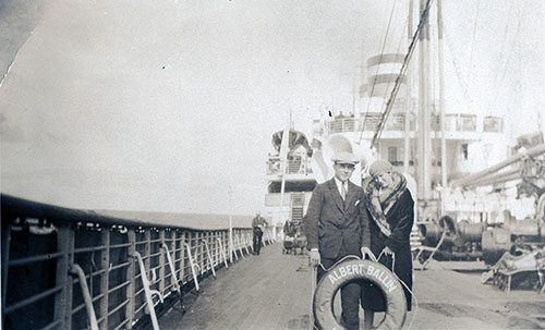Young Couple Poses Behind the Albert Ballin Life Buoy on the Deck of the SS Albert Ballin, 1927.