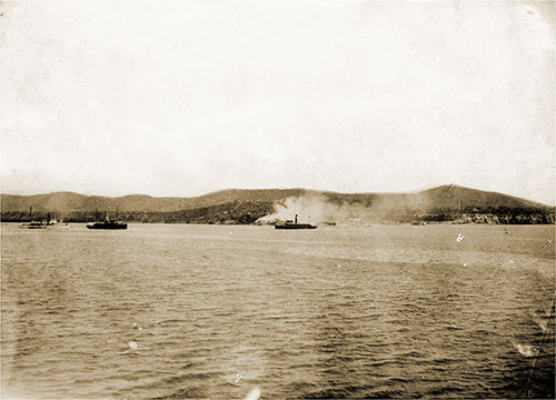 Landing Marines and burning fishing village at Guantanamo, June 10, 1898.