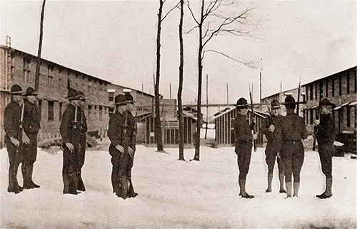 This Picture Shows the Relief of the Guard. in the Quadrangular Group, the Man on the Left Is the Old Guard at Post No. 6; He Has Been on Duty for Two Hours.