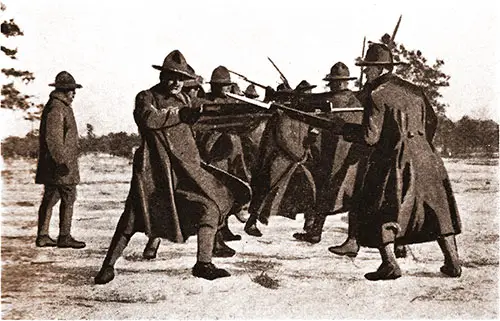 First Lieutenant H. D. White Instructing His Men From H Company of the 302d Infantry in Bayonet Drill.