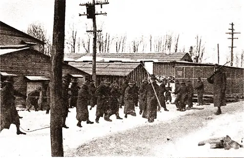 Men From the 304th Infantry Moving a Building Formerly Used as Sleeping Quarters for Civilian Workmen.