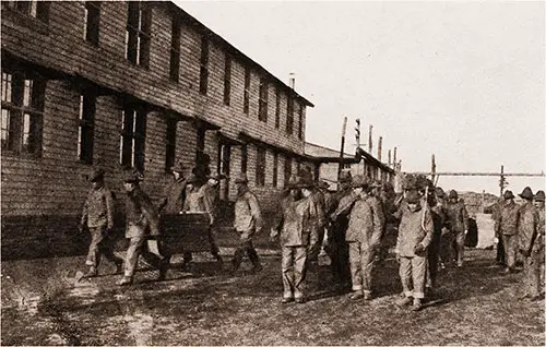 Men from the 302nd Field Artillery Shown Policing the Grounds of Camp Devens.