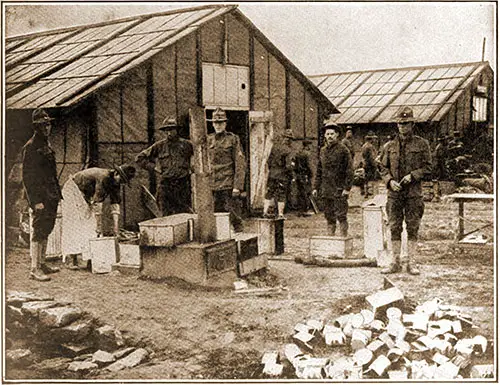 American Barracks in France. In long cantonments such as these seen above, the regulars and marines of the expeditionary force are quartered.
