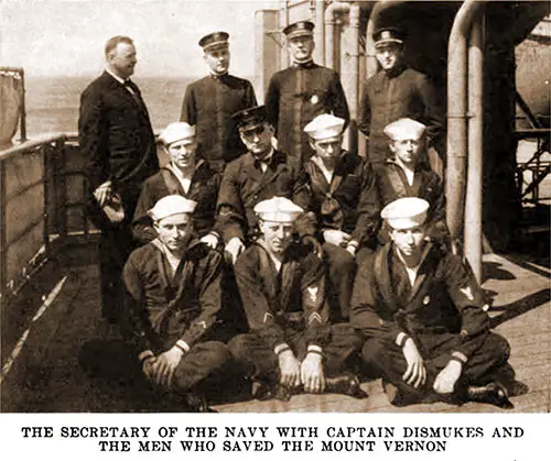 Secretary of the Navy with Captain Dismukes and the Men Who Saved the USS Mount Vernon.