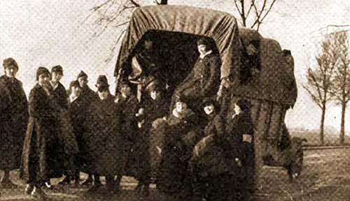 This Picture Shows Miss Flood and Some of Her Companion Operators and Army Truck in Which They Took the Long Journey Described in Her Letter.
