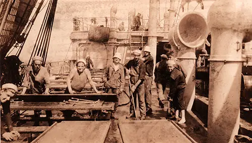 Sailors Attached to the Transport Ship “Princess Matoika” Holy Stoning Mess Tables on Deck in Advance of an Inspection. Ud, Circa 1919.